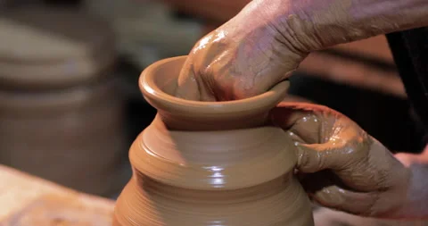 Potters wheel, hands forms clay pot on potter's wheel Stock-Footage 147270707