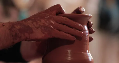 Potters wheel, hands forms clay pot on potter's wheel Stock Footage 147402613
