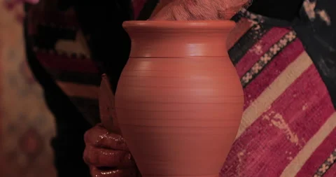 Potters wheel, hands forms clay pot on potter's wheel Stock Footage 147402646