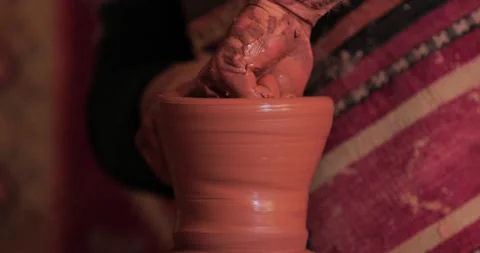 Potters wheel, hands forms clay pot on potter's wheel Stock Footage 147402819