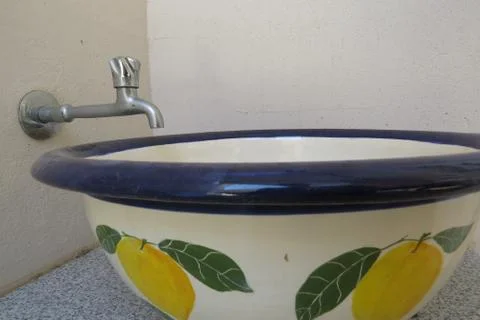 Pottery basin with tap Stock Photos