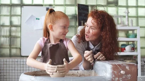 Pottery class workshop. Clay shaping on potter's wheel and firing. Stock Footage 82633677