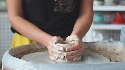 Pottery class workshop. Clay shaping on potter's wheel. Potter teaches his craft Stock Footage 82636076