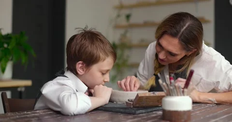 Pottery class workshop. Mom and child spend time together doing creative work Stock Footage 157737061