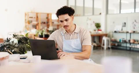 Pottery, creative and man in studio on laptop for inventory, logistics and art Stock Photos