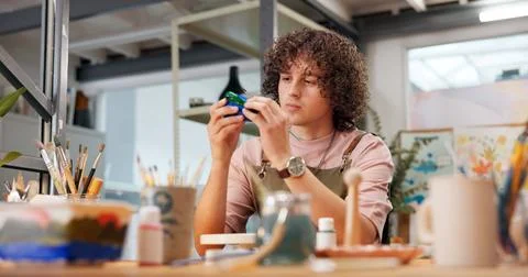 Pottery, design and man in workshop with painting, color process and bowl Stock Photos