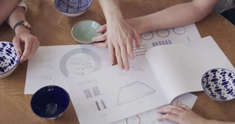 Pottery, documents and hands of team in workshop planning patterns for creative 動画素材 258337410