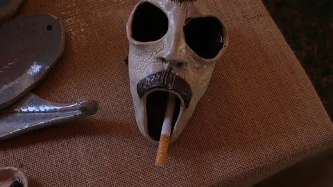 Pottery-exhibition-skull-cigarette-holder Stock Footage 101460588