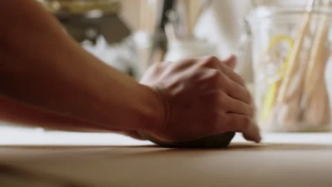 Pottery hands shaping ceramic art in a cozy workshop setting today Stock Footage 321540434