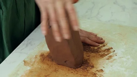 A pottery master prepares raw clay for work. Stock Footage 235758943