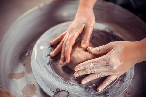 Pottery master shows how to work with clay and pottery wheel. Craft production Foto stock