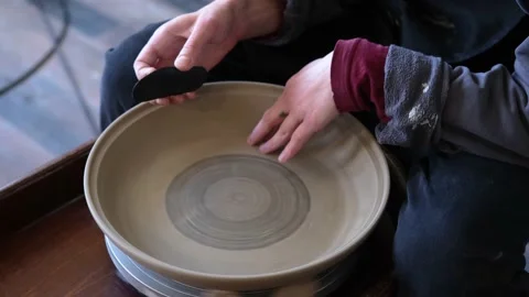 Pottery polishing process with 2 hands in the final step. 스톡 동영상 182077794