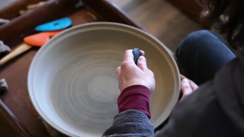 Pottery polishing process with 2 hands in the final step 스톡 동영상 182078993
