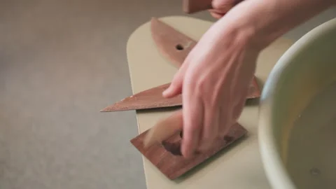 Pottery tools arranged. Pottery workspace with tools ready for creating art Stock Footage 342282030