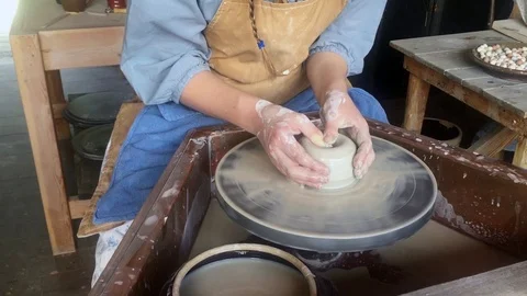 Pottery wheel being turned and clay molded HD Stock-Footage 95951291
