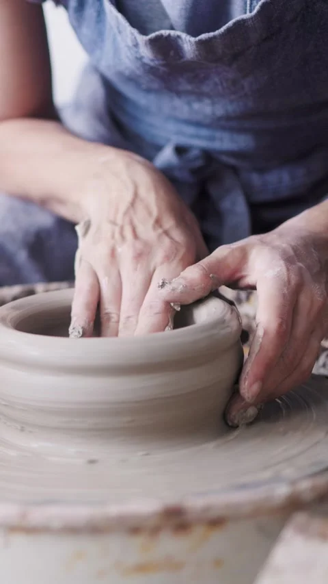 Pottery wheel, Hands work on ceramic clay workshop. Business, Vertical video Stock Footage 305703834