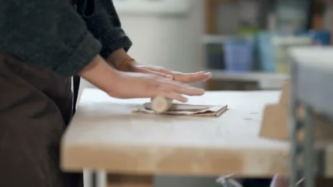 Pottery woman preparing clay using rolling pin. Stock Footage 124651228