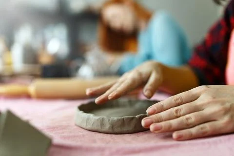 Pottery workshop class. A pottery crafts dish from a raw clay. Creating ceramics Stock Photos