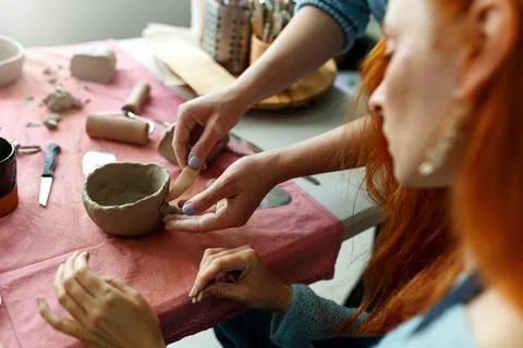 Pottery workshop class. A pottery crafts dish from a raw clay. Creating ceramics Stock Photos