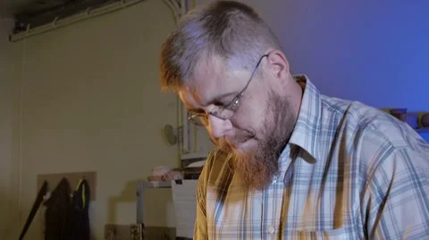 Pottery workshop, the man mixes the clay, medium shot, male portrait Stock Footage 67882000