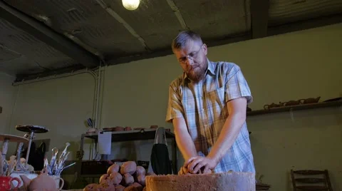 Pottery workshop, the man mixes the clay, medium shot Stock Footage 67882011