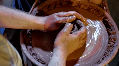 Pottery workshop, potter's wheel, close up, male hands Stock Footage 67882086