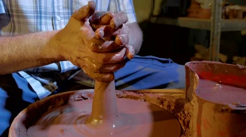 Pottery workshop, potter's wheel, close up, male hands Stock Footage 67882096