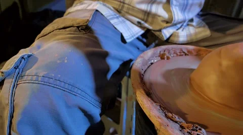 Pottery workshop, potter's wheel, close up, male hands, pan, slowmo Stock Footage 67882199