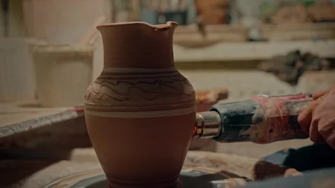 Pottery workshop. Small business in process. Ceramist drying his handicraft Stock Footage 254854565