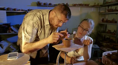 Pottery workshop, working process, male, female, medium shot Stock Footage 67882715