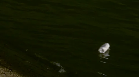 Pottle floating and polluting Stock Footage 105125