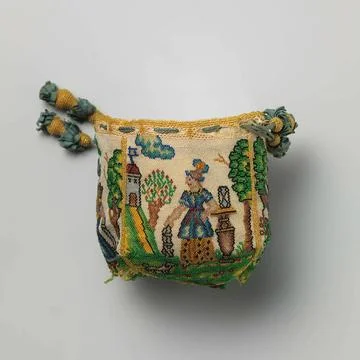 Pouch with four pattes, from side with which with multicolored glass beads... 写真素材