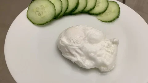 Pouched Egg Split Open with Runny Yolk Stock-Footage 124643446