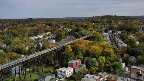 Poughkeepsie NY Fall Foliage Hudson River Walkway push turn high east Stock Footage 144420494