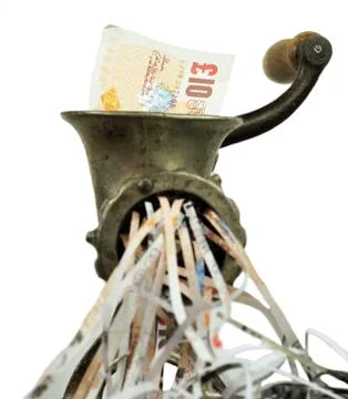 Pound note in a meat grinder Stock Photos