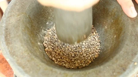 Pounding  pepper  in mortar to make curry. Thai food Stock Footage 89572968