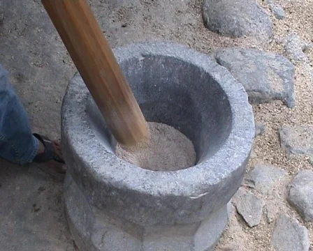  Pounding rice in the stone mortar Stock Footage 378383