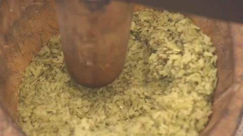 Pounding unripe rice Video stock 60695213