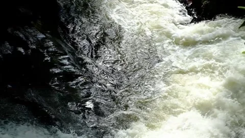 Pounding waterfall - High angle, constant camera movement - Slow Motion Stock Footage 244361528