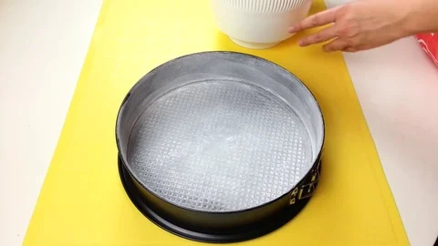 Pour batter into a baking dish Stock Footage 72508642