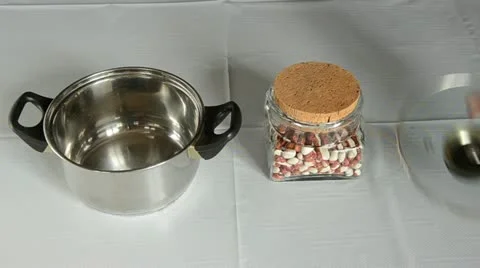 Pour beans in the metallic pot Stock Footage 10819260