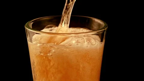 Pour beer from the bottle to the last drop Pouring cold beer into glass. Stock Footage 265765583