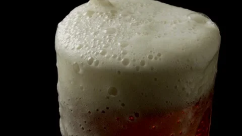 Pour beer from the bottle to the last drop Pouring cold beer into glass. Stock Footage 265767523