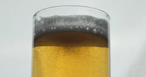 Pour beer in glass close up Stock Footage 154086161