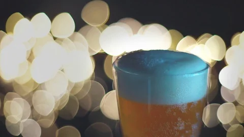 Pour the beer into the glass. Stock Footage 79640482