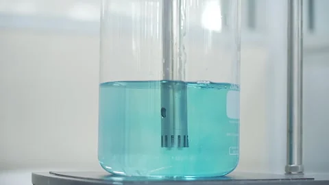 Pour Blue Solution to Mixing Machine Close up Slow-motion 50fps Video stock 247487969