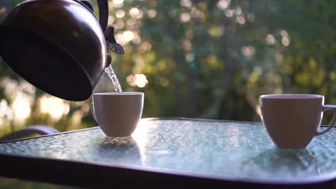 Pour boiling water from the kettle into a cup. Close up Stock Footage 250964259