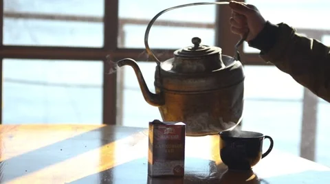Pour boiling water from the old kettle. Video stock 46502307