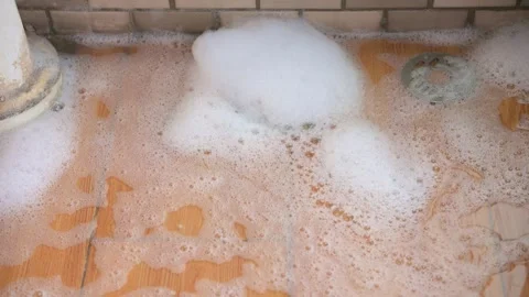 Pour the bubbly water down the drain Stock-Footage 329909873