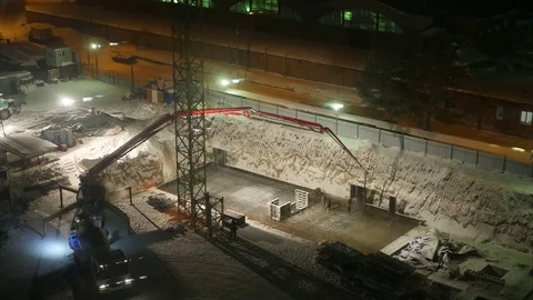 Pour cement foundations of the building at night under floodlights, time lapse Stock Footage 71882852